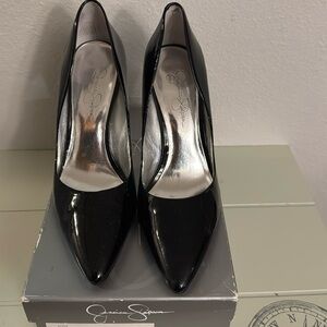 Patent black pumps by Jessica Simpson size 9.5. Unique gorgeous heel!